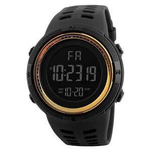 Close-up of black men's digital sports watch with large display and golden bezel