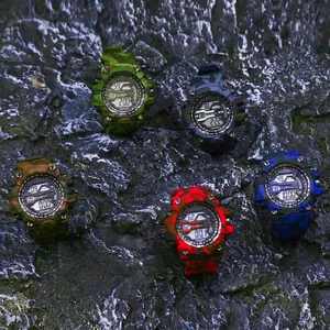 Set of five colorful camouflage digital sport watches for men on rugged rock