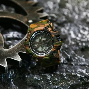 Camouflage outdoor sports digital watch with industrial gear background