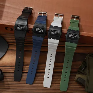 Detail showing square digital watches in black, blue, white, and green silicone straps.