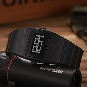 Close-up of stylish black square digital watch with silicone strap on a telescope prop