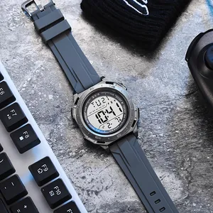 Detailed view of a multi-function digital sports watch with grey silicone strap