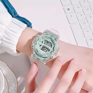 Close-up of a transparent sports digital watch with mint green accents worn on a wrist.