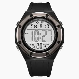 Macro shot of a black digital sports watch with multiple functions on a white background