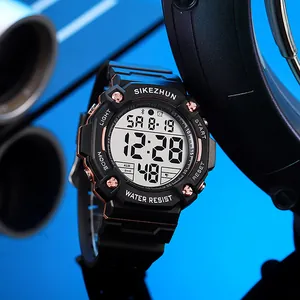 Close-up of a digital sports watch with black strap and rose gold accents