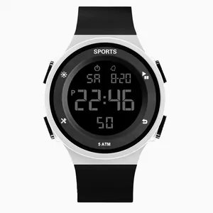 Close-up of a white digital sports watch with a black silicone strap and display.