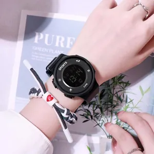 Detailed close-up of a black waterproof digital sports watch on a wrist.