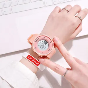 Macro view of pink digital sports watch on a wrist with Candycat band