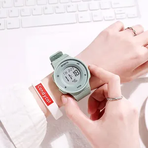 Close-up of a mint green digital sports watch for teens with waterproof 5 ATM dial