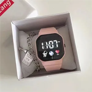 Stylish pink digital watch with astronaut icon and silver chain bracelet in a gift box
