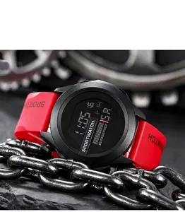 Close-up of a digital sport watch featuring a red strap and black face display