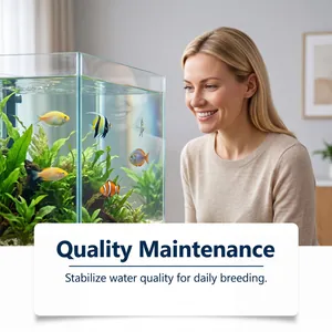 A woman observing a crystal clear aquarium with tropical fish after water treatment.