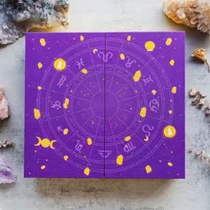 Macro view of purple reiki crystal Halloween countdown gift box with zodiac design motifs.