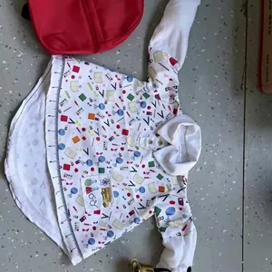 Detailed view of white porch goose costume featuring colorful school supply patterns