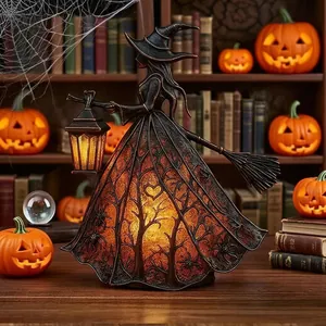 Detailed view of a gothic Halloween witch lamp with glowing forest pattern dress.