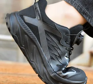 Detail of black safety shoe with flexible EVA sole and quick rotary dial lacing system