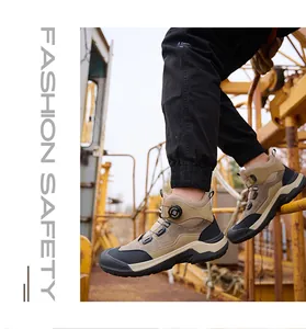 Close-up of men's high-top safety work boots with a rotary buckle dial system.