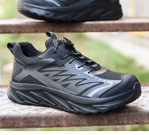 Close-up detail of black breathable safety shoes with EVA sole and quick lacing system.