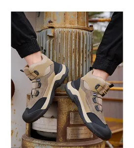 Detail of men's khaki high-top safety work boots with steel toe and rotary buckle.