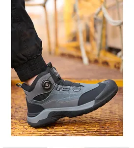 Close-up of grey high-top safety work shoe with rotary buckle on model's foot