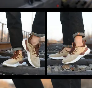 Primer plano de zapatillas de seguridad color caqui usadas en vías de tren al aire libre.