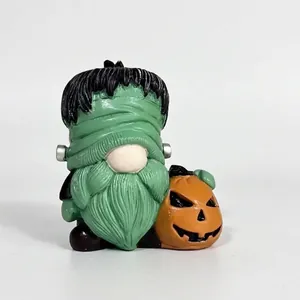 Halloween Frankenstein gnome figurine holding a spooky pumpkin resin ornament for home