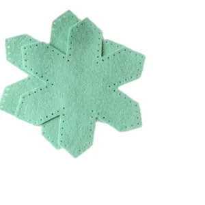 Mint green felt snowflake decoration kit with pre-punched holes for DIY Christmas sewing