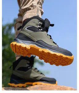 Men's olive green safety boots with puncture-resistant orange lugged sole