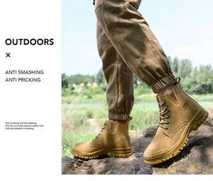 Outdoor view of tan high-top steel toe safety work boots for men's construction site