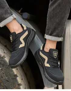 Black safety sneakers with anti-smashing steel toe and breathable mesh detail for work