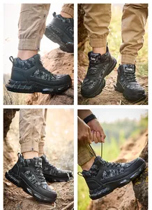 Close-up details of men's camouflage safety work boots on rugged rocky terrain outdoor