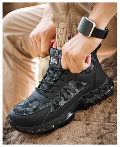 Close-up of black camouflage safety work boots with durable puncture-resistant sole