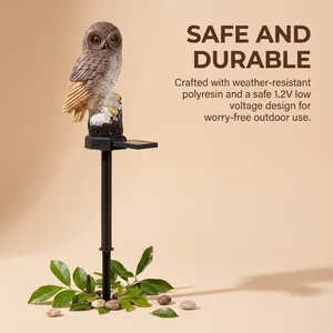 Close-up view of a weather-resistant polyresin owl solar stake light for garden decor