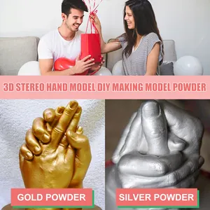 Close-up of DIY 3D hand models with gold and silver powder finish for keepsake gifts