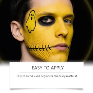 Detailansicht der glatten Anwendung von professioneller gelber Halloween-Gesichtsfarbe