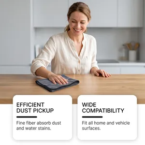 Grey microfiber cleaning cloth efficiently wiping dust from a wooden kitchen surface
