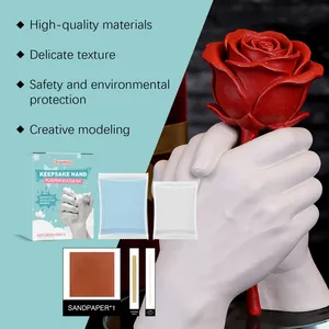 Detailed view of DIY keepsake hand plaster statue kit including powder and tools