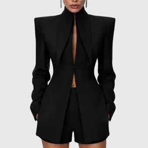 Detail of black avant-garde structural blazer with sharp high shoulders and slim fit.