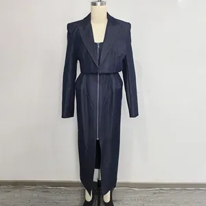 Front view detail of an elegant dark blue denim jacket and matching long skirt