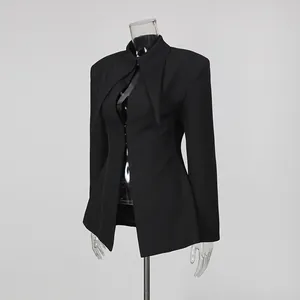 Detailed side view of a black tailored blazer featuring unique oversized pointed lapels