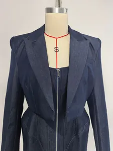 Elegant blue denim two-piece set featuring a tailored jacket and matching zip-front skirt