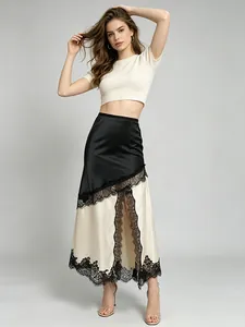 Elegant high-waist black and beige lace-trimmed midi skirt with a high side slit.