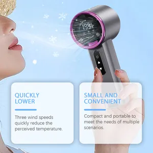 Close-up of portable high-speed fan providing cooling breeze for user's face