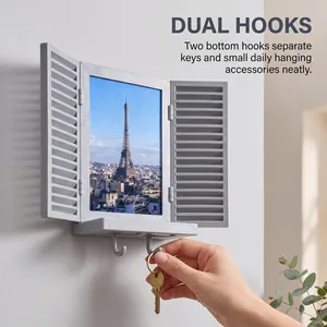 Close-up detail of the grey wall-mounted key rack frame featuring dual hooks