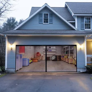 Durable mesh magnetic garage door screen protector installed on a house at dusk