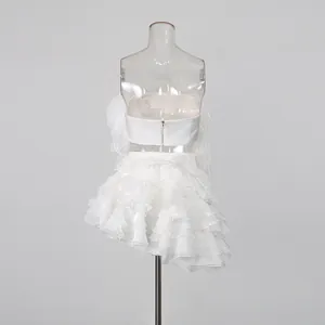 Detailed back view of white tube top and tiered ruffle skirt set on mannequin