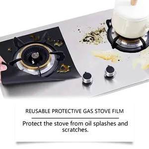 Detail showing reusable black gas stove protector film preventing oil splashes