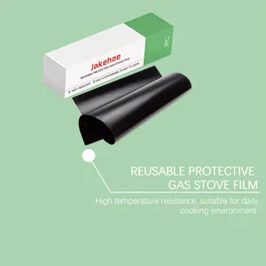 Close-up of reusable black gas stove protective film with green packaging details.