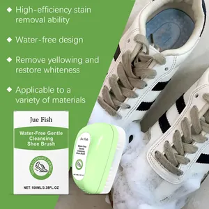 Detail view of Jue-Fish water-free shoe brush cleaning yellowed stains on sneakers.