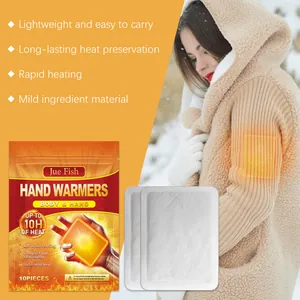 Detailed view of JUE FISH disposable hand warmer patches and usage on a warm coat.